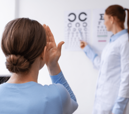 What causes blurred or distorted distance vision?